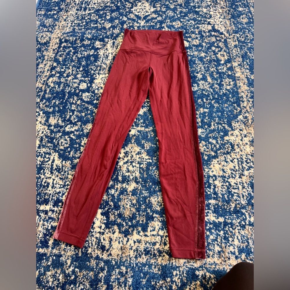 Lululemon Leggings in a red color with velvet strips on the side, Size 6